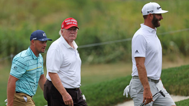 BEDMINSTER, NEW JERSEY - JULY 28: (L-R) Team Captain Bryson DeChambeau of Crushers GC, former U.S. President Donald Trump and team Captain Dustin Johnson of 4 Aces GC walk off the 14th green during the pro-am prior to the LIV Golf Invitational - Bedminster at Trump National Golf Club Bedminster on July 28, 2022 in Bedminster, New Jersey.