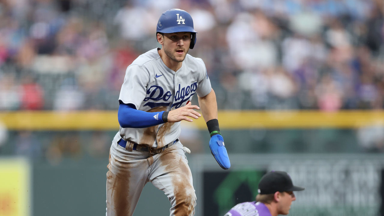 DENVER, COLORADO - JULY 28: Trea Turner #6 of the Los Angeles Dodgers scores on a fielding error against the Colorado Rockies in the first inning at Coors Field on July 28, 2022 in Denver, Colorado.
