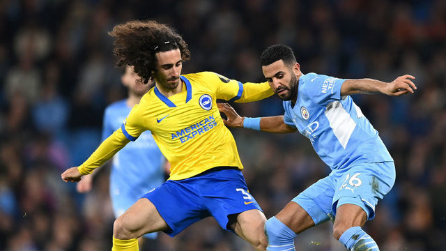 MANCHESTER, ENGLAND - APRIL 20: Riyad Mahrez of Manchester City is challenged by Marc Cucurella of Brighton & Hove Albion during the Premier League match between Manchester City and Brighton & Hove Albion at Etihad Stadium on April 20, 2022 in Manchester, England.
