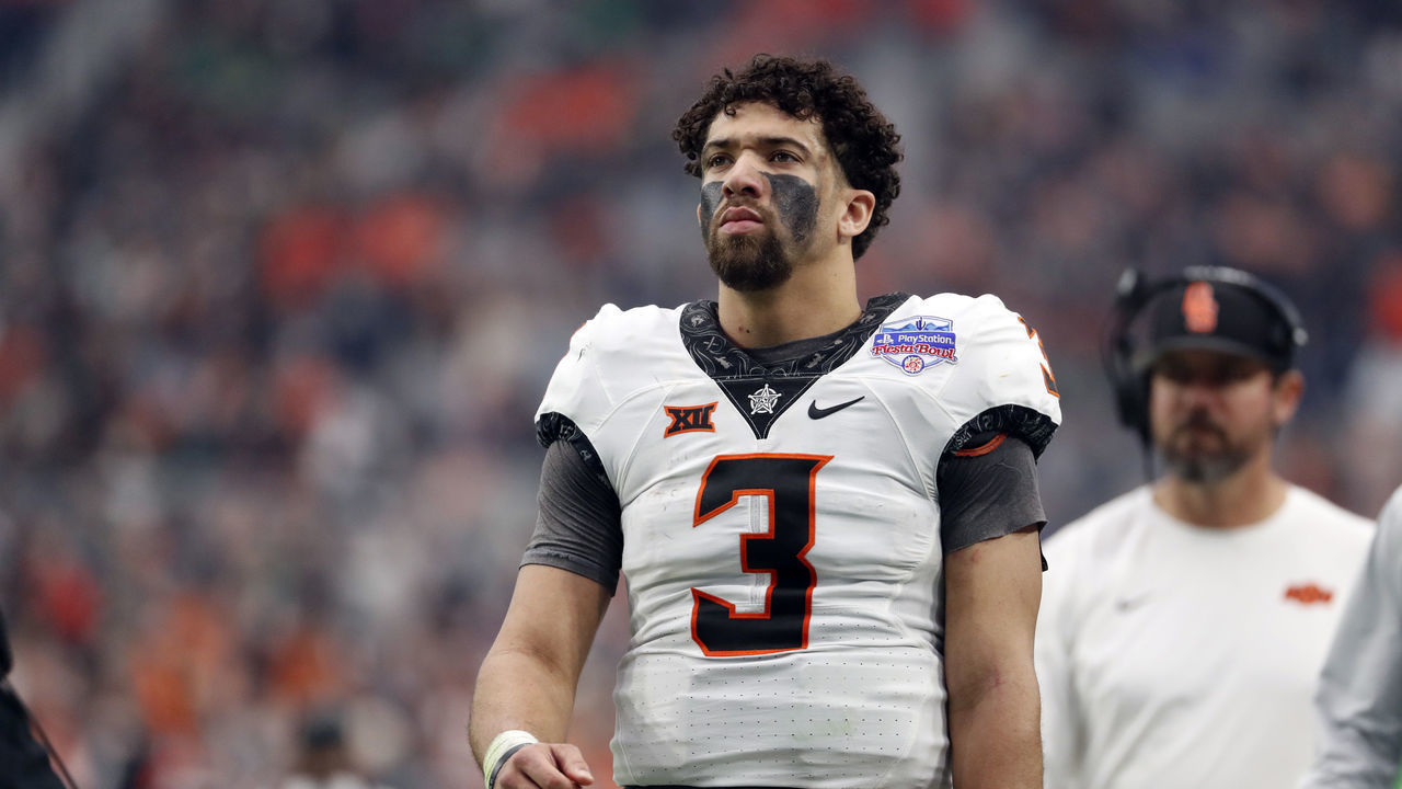 GLENDALE, ARIZONA - JANUARY 01: Quarterback Spencer Sanders #3 of the Oklahoma State Cowboys walks on the sideline during the second half of the PlayStation Fiesta Bowl against the Notre Dame Fighting Irish at State Farm Stadium on January 01, 2022 in Glendale, Arizona. The Cowboys defeated the Fighting Irish 37-35.