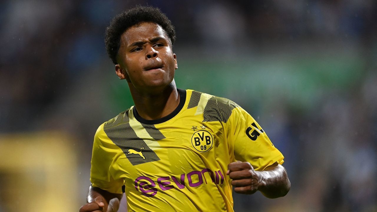 Dortmund's German forward Karim Adeyemi celebrates scoring the 0-3 goal during the German Cup (DFB Pokal) first round football match TSV 1860 Munich v BVB Borussia Dortmund at the Gruenwalder Street Stadium in Munich, southern Germany on July 29, 2022. - DFB REGULATIONS PROHIBIT ANY USE OF PHOTOGRAPHS AS IMAGE SEQUENCES AND QUASI-VIDEO.