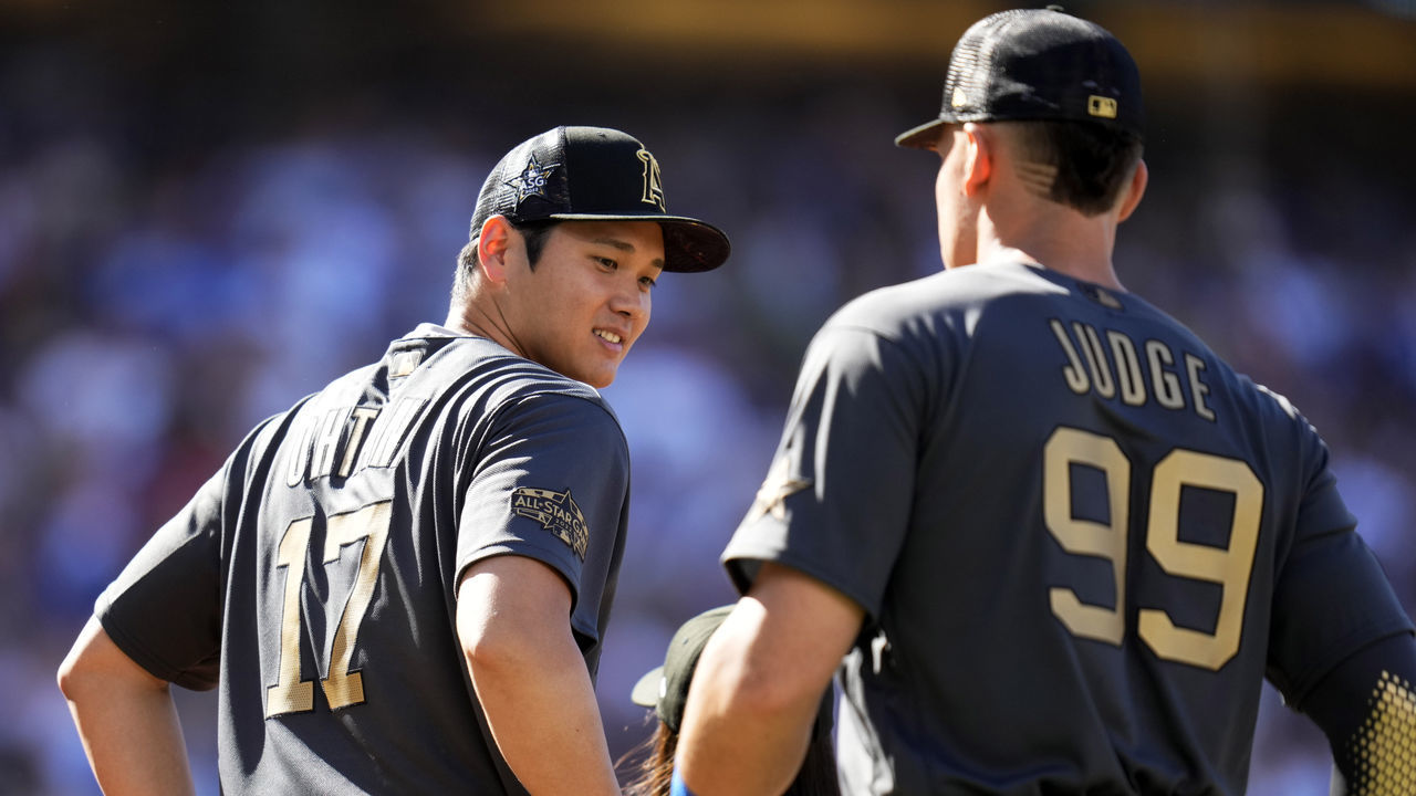 Los Angeles, CA - July 19: American League All-Star outfielders Aaron Judge, right, along with American League All-Star Shohei Ohtani of the Los Angeles Angels line up before an MLB All-Star baseball game against the National League All-Stars at Dodger Stadium in Los Angeles on Tuesday, July 19, 2022.