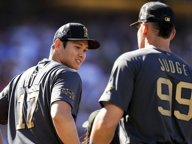 Los Angeles, CA - July 19: American League All-Star outfielders Aaron Judge, right, along with American League All-Star Shohei Ohtani of the Los Angeles Angels line up before an MLB All-Star baseball game against the National League All-Stars at Dodger Stadium in Los Angeles on Tuesday, July 19, 2022.