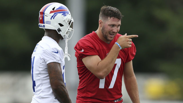 PITTSFORD, NEW YORK - JULY 24: Josh Allen #17 of the Buffalo Bills speaks with Stefon Diggs #14 during Bills training camp at Saint John Fisher University on July 24, 2022 in Pittsford, New York.