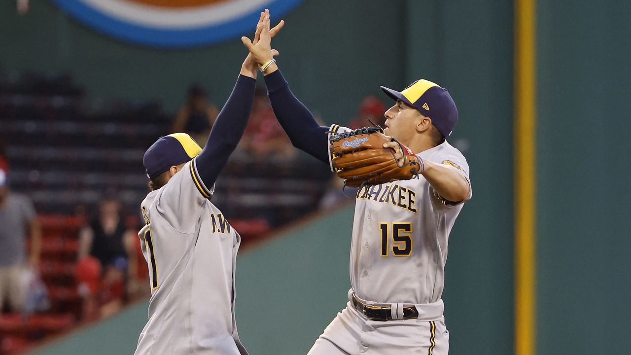 BOSTON, MA - JULY 30: Tyrone Taylor #15 of the Milwaukee Brewers high fives Willy Adames #27 after their 9-4 win over the Boston Red Sox at Fenway Park on July 30, 2022 in Boston, Massachusetts.