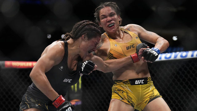 DALLAS, TEXAS - JULY 30: (R-L) Amanda Nunes of Brazil punches Julianna Pena in the UFC bantamweight championship fight during the UFC 277 event at American Airlines Center on July 30, 2022 in Dallas, Texas.