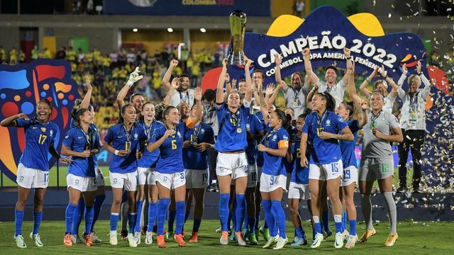 Brazil's players celebrate with the trophy after winning the Conmebol 2022 women's Copa America football tournament final match against Colombia at the Alfonso Lopez stadium in Bucaramanga, Colombia, on July 30, 2022.