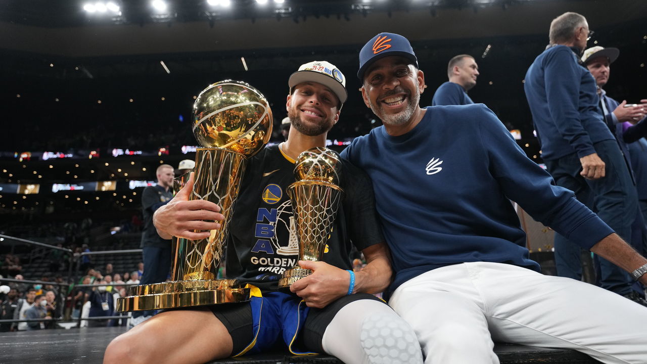 BOSTON, MA - JUNE 16: Stephen Curry #30 of the Golden State Warriors celebrates on stage with The Larry O'Brien Trophy and the Bill Russell Finals MVP Trophy after winning during Game Six of the 2022 NBA Finals on June 16, 2022 at TD Garden in Boston, Massachusetts. NOTE TO USER: User expressly acknowledges and agrees that, by downloading and or using this photograph, user is consenting to the terms and conditions of Getty Images License Agreement. Mandatory Copyright Notice: Copyright 2022 NBAE