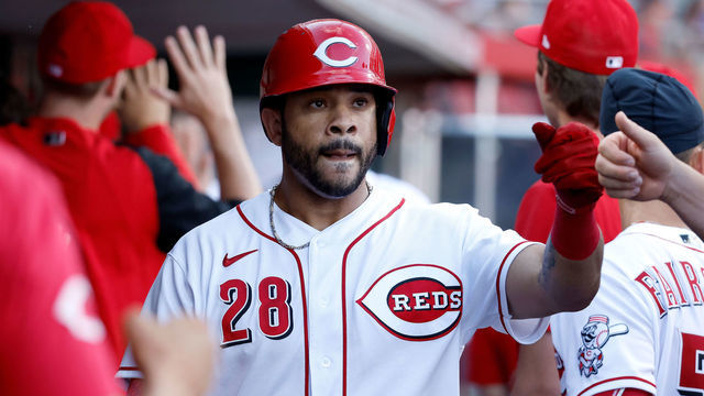 CINCINNATI, OH - JULY 27: Tommy Pham #28 of the Cincinnati Reds is congratulated by his teammates after scoring a run during the first inning of the game against the Miami Marlins at Great American Ball Park on July 27, 2022 in Cincinnati, Ohio.