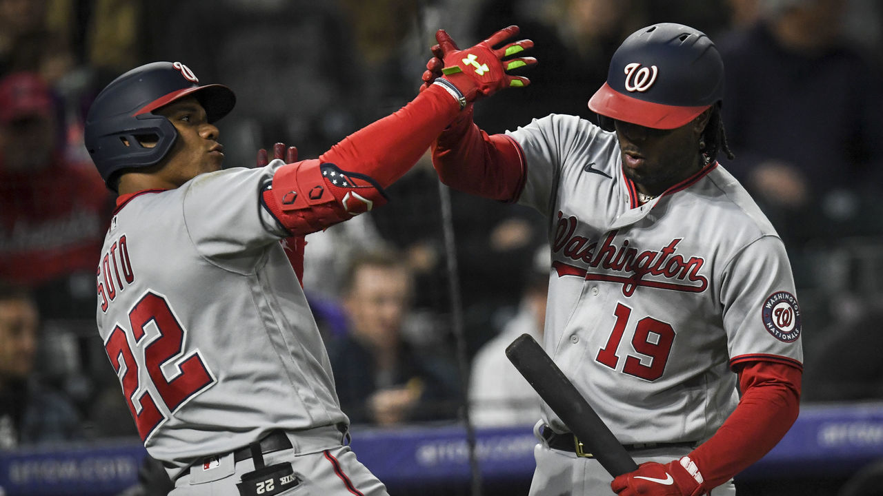 DENVER, CO - MAY 3: Juan Soto (22) of the Washington Nationals celebrates with Josh Bell (19) after hitting a solo homerun off of German Marquez (48) of the Colorado Rockies during the fifth inning at Coors field on Tuesday, May 3, 2022.