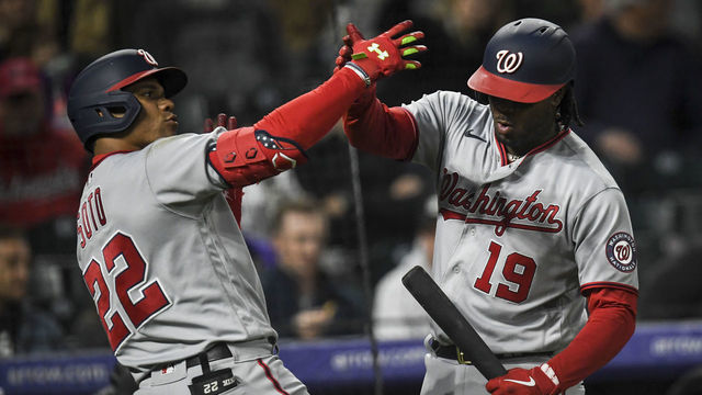 DENVER, CO - MAY 3: Juan Soto (22) of the Washington Nationals celebrates with Josh Bell (19) after hitting a solo homerun off of German Marquez (48) of the Colorado Rockies during the fifth inning at Coors field on Tuesday, May 3, 2022.
