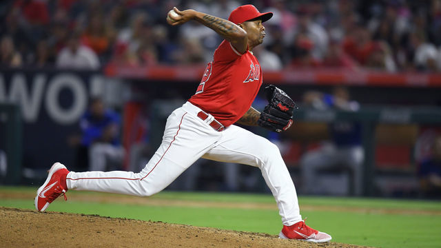 ANAHEIM, CA - JULY 30: Raisel Iglesias #32 of the Los Angeles Angels pitches while playing the Texas Rangers at Angel Stadium of Anaheim on July 30, 2022 in Anaheim, California.