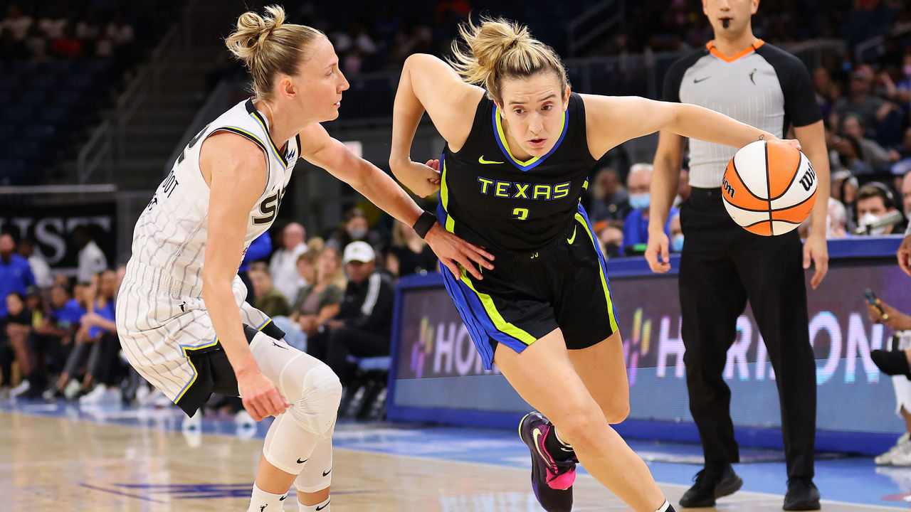 CHICAGO, ILLINOIS - AUGUST 02: Marina Mabrey #3 of the Dallas Wings drives to the basket against Courtney Vandersloot #22 of the Chicago Sky during the first half at Wintrust Arena on August 02, 2022 in Chicago, Illinois.