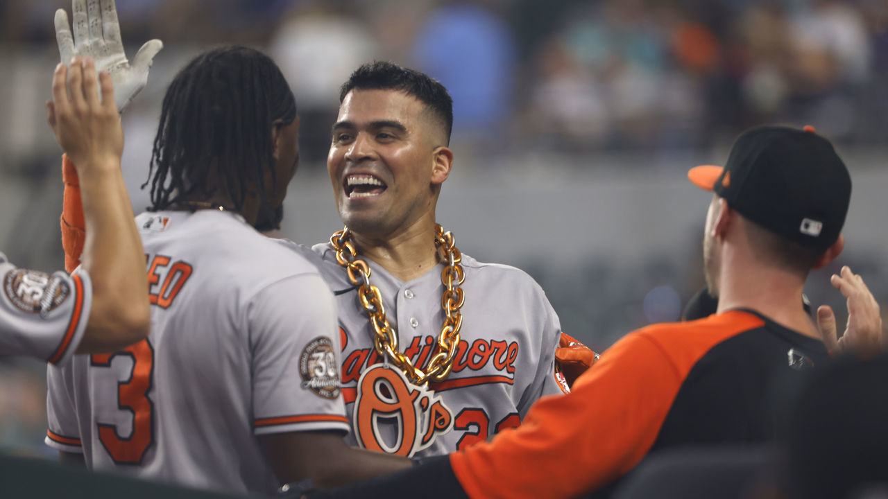 ARLINGTON, TX - AUGUST 3: Robinson Chirinos #23 of the Baltimore Orioles celebrates with teammates after hitting a solo home run against the Texas Rangers during the seventh inning at Globe Life Field on August 3, 2022 in Arlington, Texas.