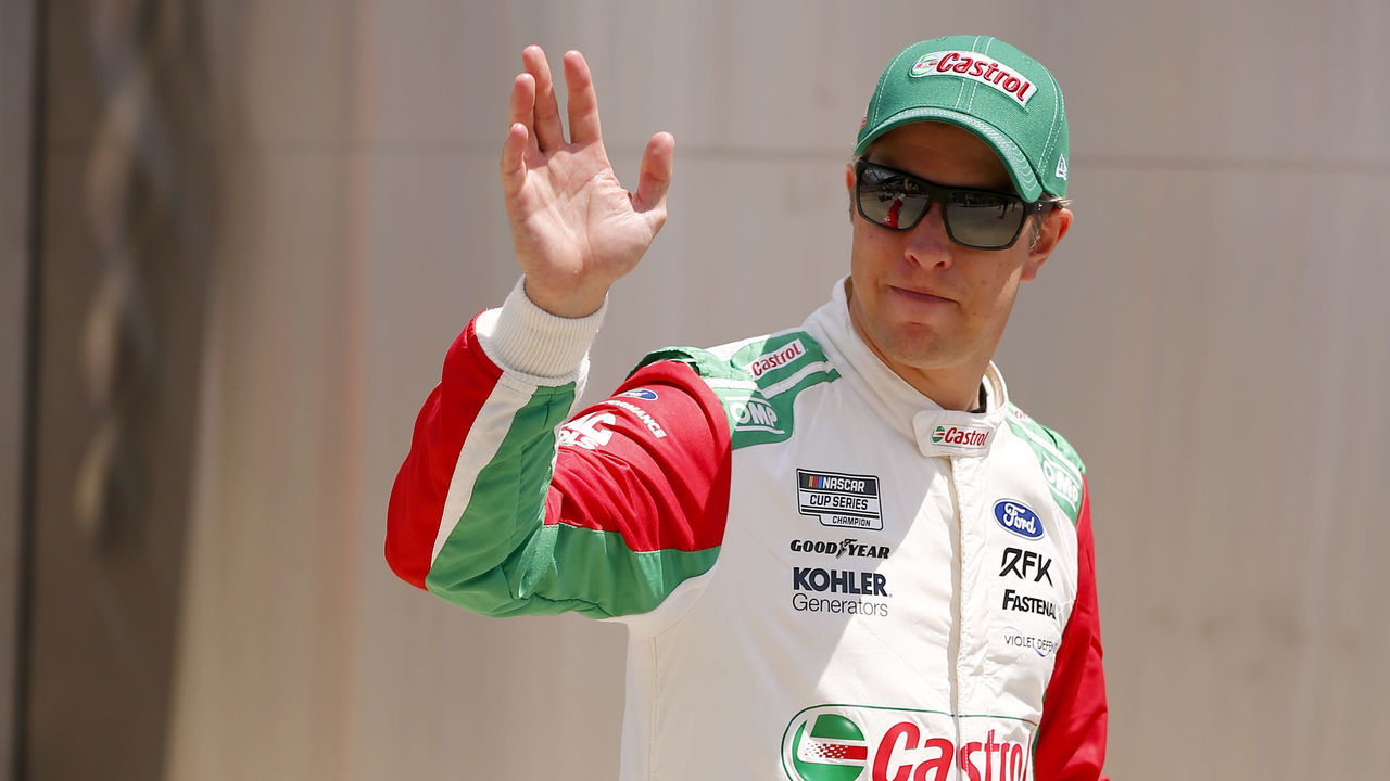 INDIANAPOLIS, IN - JULY 31: Brad Keselowski (#6 RFK Racing Castrol Ford) waves to fans as he walks to pit lane after driver introductions during the NASCAR Cup Series Verizon 200 at the Indianapolis Motor Speedway Road Course on July 31, 2022 in Indianapolis, IN.