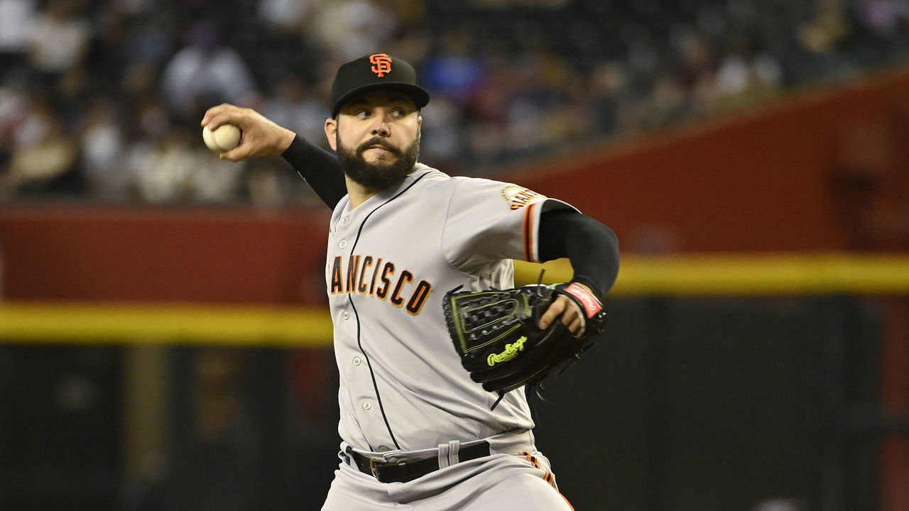 PHOENIX, ARIZONA - JULY 25: Starting pitcher Jakob Junis #34 of the San Francisco Giants pitches against the Arizona Diamondbacks during the first inning of the MLB game at Chase Field on July 25, 2022 in Phoenix, Arizona.
