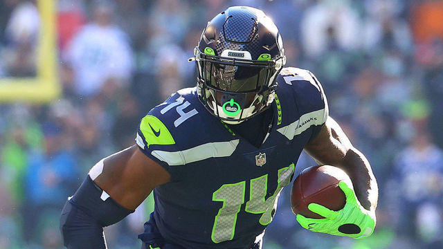 SEATTLE, WASHINGTON - OCTOBER 31: DK Metcalf #14 of the Seattle Seahawks runs with the ball against the Jacksonville Jaguars during the second quarter at Lumen Field on October 31, 2021 in Seattle, Washington.