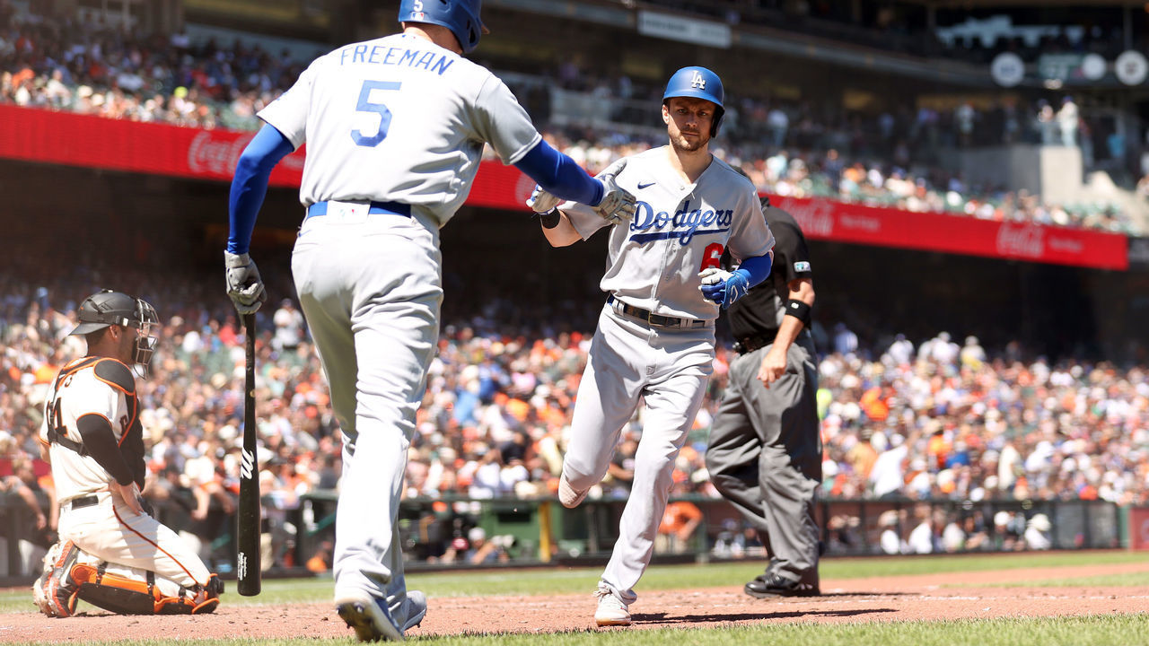 SAN FRANCISCO, CALIFORNIA - AUGUST 04: Trea Turner #6 of the Los Angeles Dodgers is congratulated by Freddie Freeman #5 after he hit a home run in the seventh inning at Oracle Park on August 04, 2022 in San Francisco, California.