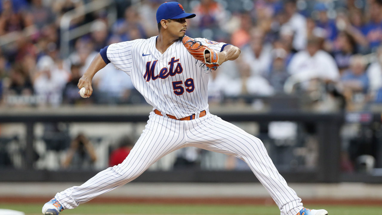 NEW YORK, NEW YORK - AUGUST 04: Carlos Carrasco #59 of the New York Mets pitches in the first inning against the Atlanta Braves at Citi Field on August 04, 2022 in New York City.