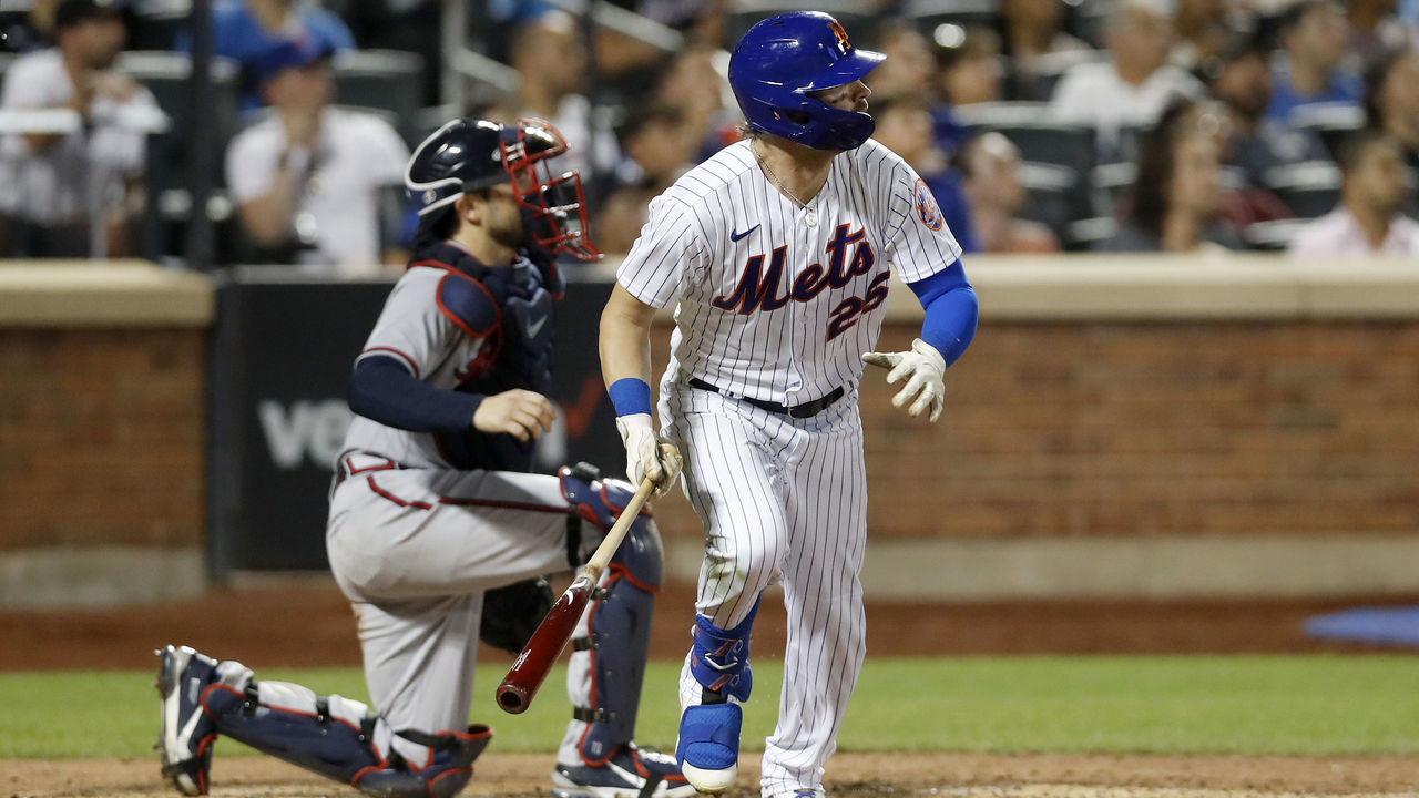 NEW YORK, NEW YORK - AUGUST 04: Tyler Naquin #25 of the New York Mets hits a solo home run, his second of the game, in the sixth inning against the Atlanta Braves at Citi Field on August 04, 2022 in New York City.