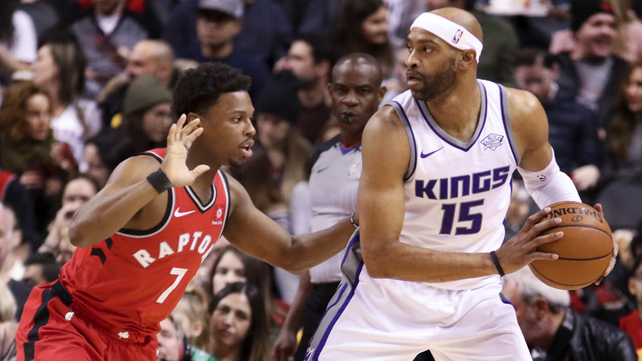 TORONTO, ON - DECEMBER, 17 In first half action, Toronto Raptors guard Kyle Lowry (7) guards Sacramento Kings guard Vince Carter (15). The Toronto Raptors took on the Sacramento Kings at the Air Canada Centre in Toronto. This could be the last game that former Raptor star Vince Carter plays in Toronto. ACC, NBA, sport, basketball, sport, ball, hoop December, 17 2017 (Richard Lautens/Toronto Star via Getty Images)