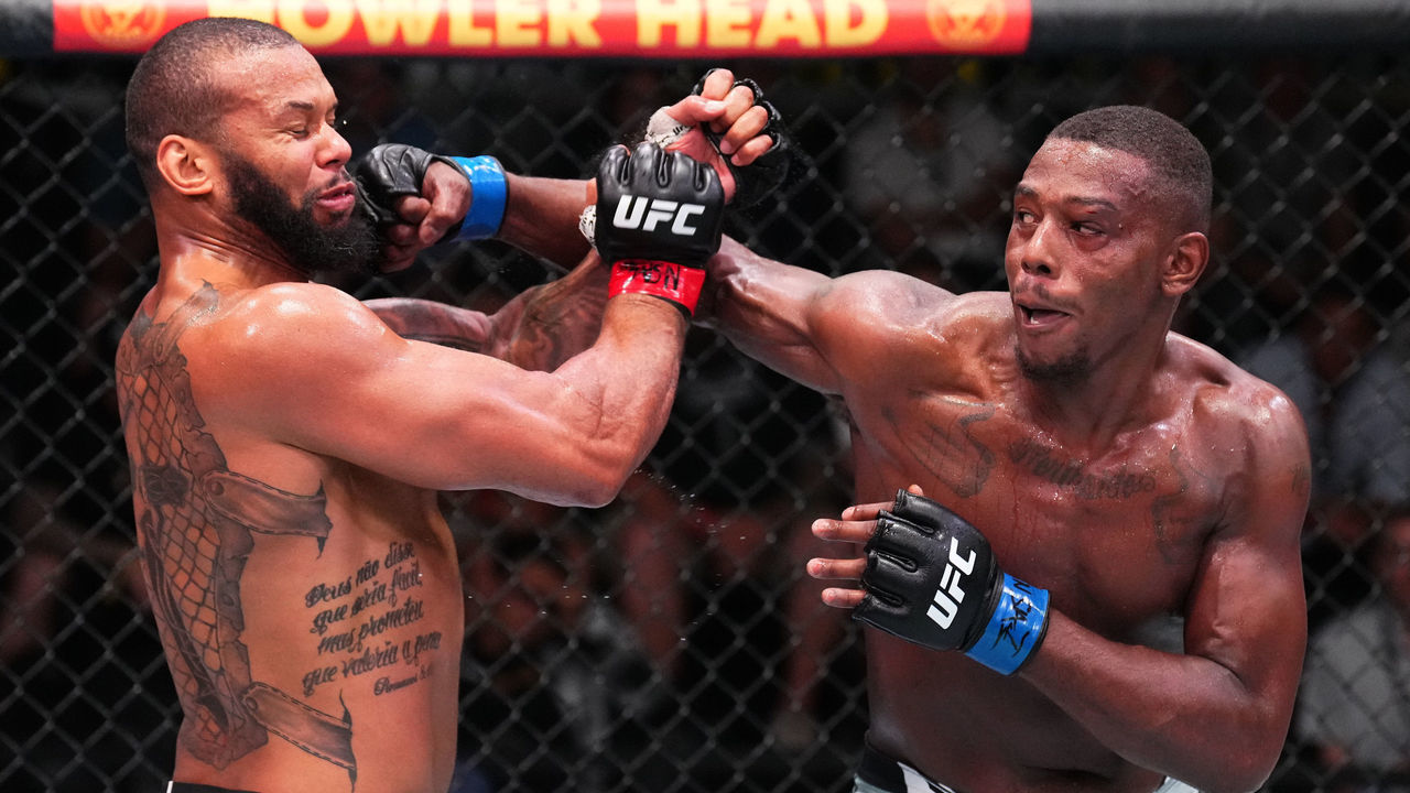 LAS VEGAS, NEVADA - AUGUST 06: (R-L) Jamahal Hill punches Thiago Santos of Brazil in a light heavyweight fight during the UFC Fight Night event at UFC APEX on August 06, 2022 in Las Vegas, Nevada.