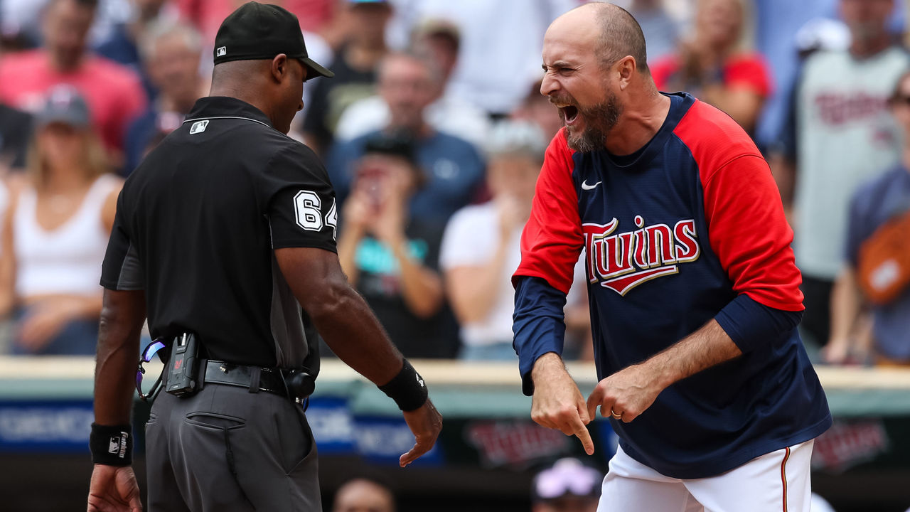 MINNEAPOLIS, MN - AUGUST 07: Rocco Baldelli #5 of the Minnesota Twins argues with umpire Alan Porter #64 after a coach's challenge determined Whit Merrifield #1 of the Toronto Blue Jays scored a run at home plate against Gary Sanchez #24 of the Minnesota Twins due to Sanchez blocking the plate in the tenth inning of the game at Target Field on August 7, 2022 in Minneapolis, Minnesota. The Blue Jays defeated the Twins 3-2 in ten innings.