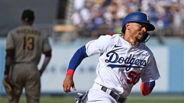 LOS ANGELES, CA - AUGUST 07: Los Angeles Dodgers outfielder Mookie Betts (50) scores on a single by Los Angeles Dodgers infielder Freddie Freeman (5) during the third inning of a game between the Los Angeles Dodgers and San Diego Padres on August 7, 2022 at Dodger Stadium in Los Angeles, CA.