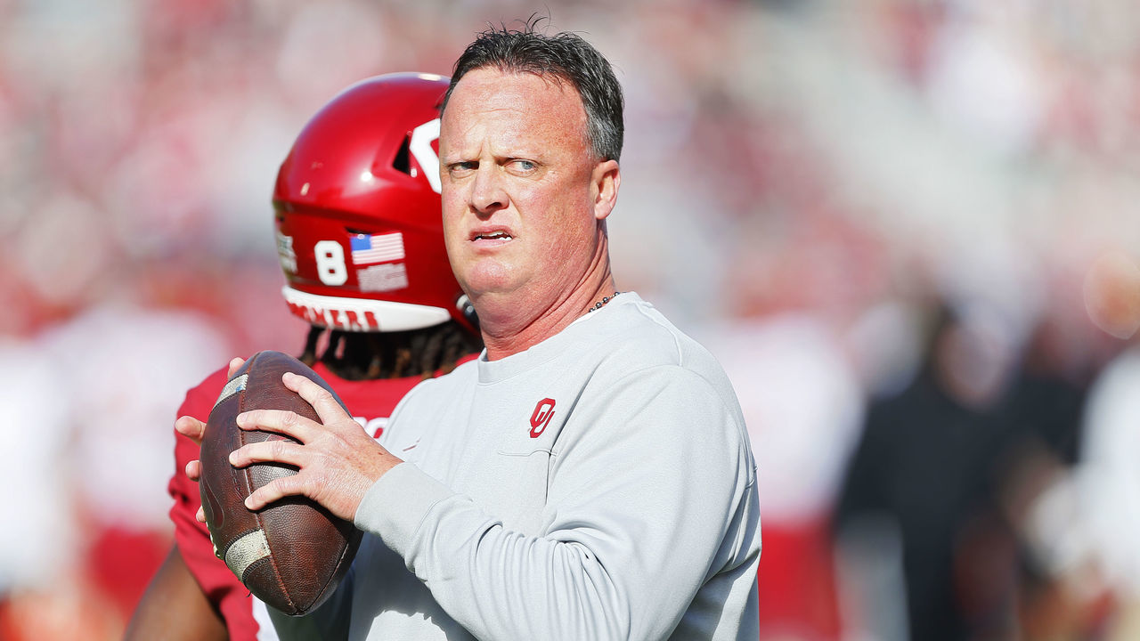 NORMAN, OK - NOVEMBER 20: Offensive coordinator Cale Gundy of the Oklahoma Sooners throws passes before a game against the Iowa State Cyclones at Gaylord Family Oklahoma Memorial Stadium on November 20, 2021 in Norman, Oklahoma. The Sooners won 28-21.