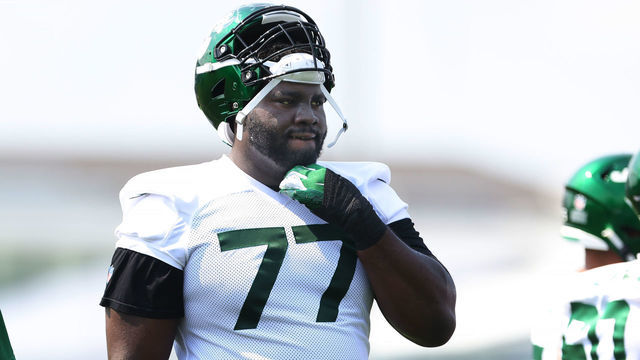 FLORHAM PARK, NJ - JULY 28: Mekhi Becton #77 of the New York Jets during morning practice at Atlantic Health Jets Training Center on July 28, 2021 in Florham Park, New Jersey.