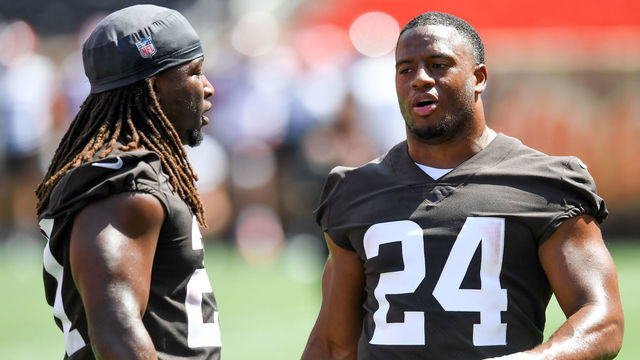 CLEVELAND, OH - JUNE 16: Nick Chubb #24 of the Cleveland Browns talks with Kareem Hunt #27 during the Cleveland Browns mandatory minicamp at FirstEnergy Stadium on June 16, 2022 in Cleveland, Ohio.