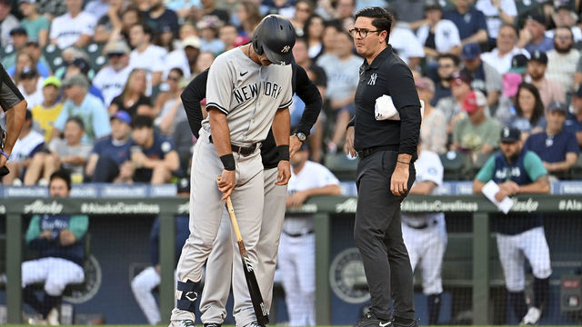 SEATTLE, WASHINGTON - AUGUST 08: Matt Carpenter #24 of the New York Yankees points with his bat to where the foul tip ball hit him during the first inning against the Seattle Mariners at T-Mobile Park on August 08, 2022 in Seattle, Washington.