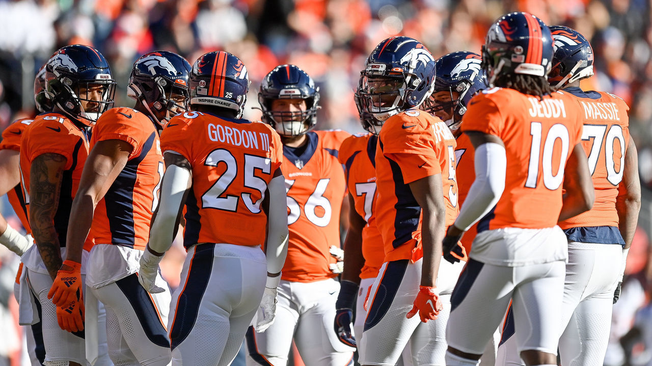 DENVER, CO - DECEMBER 19: The Denver Broncos offense huddles around quarterback Teddy Bridgewater (5) during a game between the Denver Broncos and the Cincinnati Bengals at Empower Field at Mile High on December 19, 2021 in Denver, Colorado.