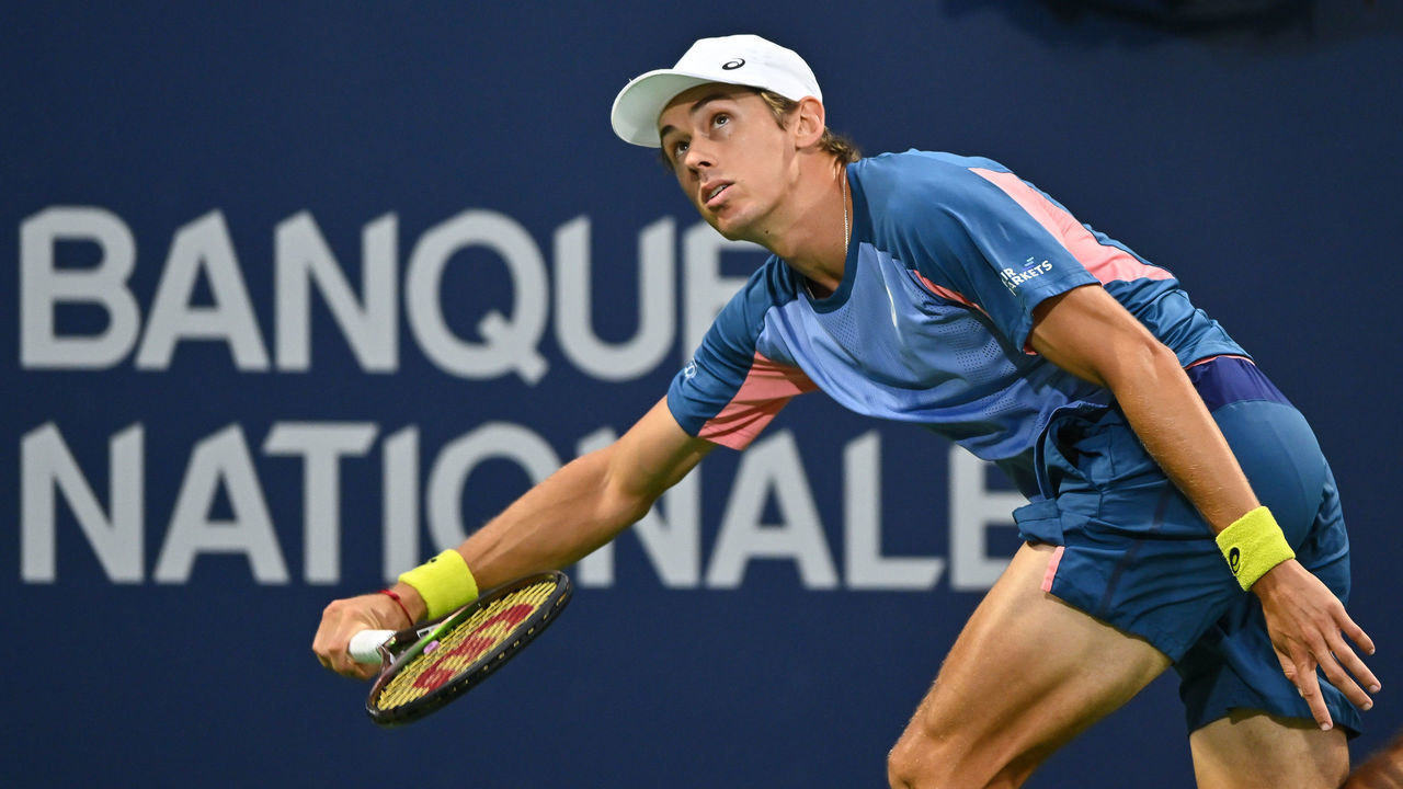 MONTREAL, QUEBEC - AUGUST 08: Alex de Minaur of Australia runs against Denis Shapovalov of Canada during Day 3 of the National Bank Open at Stade IGA on August 8, 2022 in Montreal, Canada. Play has been suspended until tomorrow due to heavy rainfall.