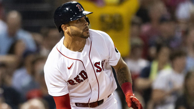 BOSTON, MA - AUGUST 9: Tommy Pham #22 of the Boston Red Sox hits a solo home run during the third inning of a game against the Atlanta Braves on August 9, 2022 at Fenway Park in Boston, Massachusetts. It was his debut game at Fenway Park as a member of the Boston Red Sox.