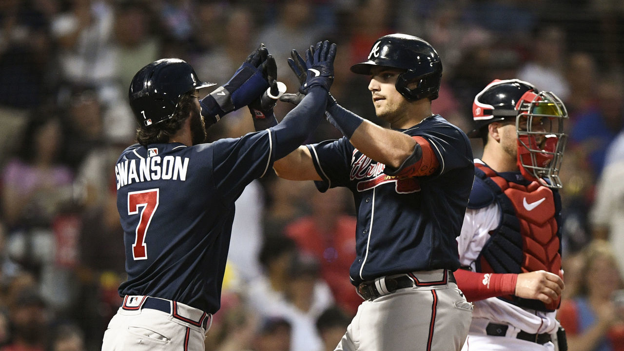 BOSTON, MASSACHUSETTS - AUGUST 09: Austin Riley #27 of the Atlanta Braves celebrates his two-run home run with Dansby Swanson #7 against the Boston Red Sox in the third inning at Fenway Park on August 09, 2022 in Boston, Massachusetts.