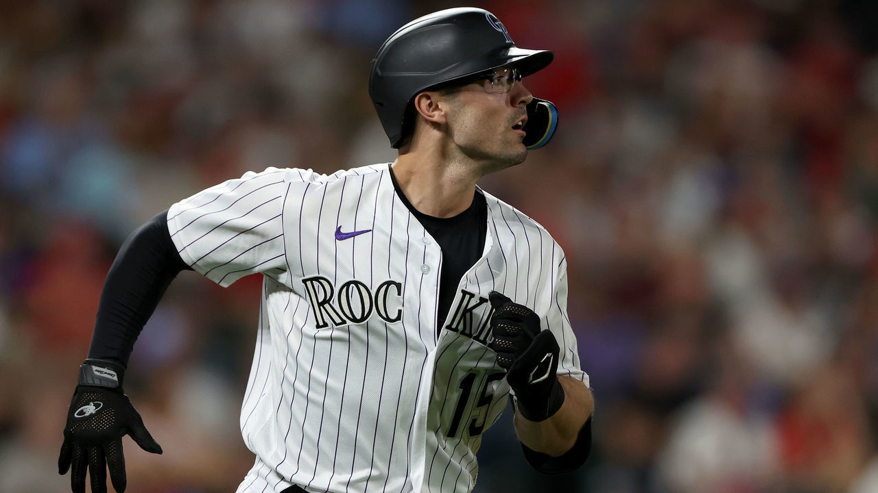 DENVER, COLORADO - AUGUST 09: Randal Grichuk #15 of the Colorado Rockies runs the baseline after hitting a single against the St Louis Cardinals in the sixth inning at Coors Field on August 09, 2022 in Denver, Colorado.