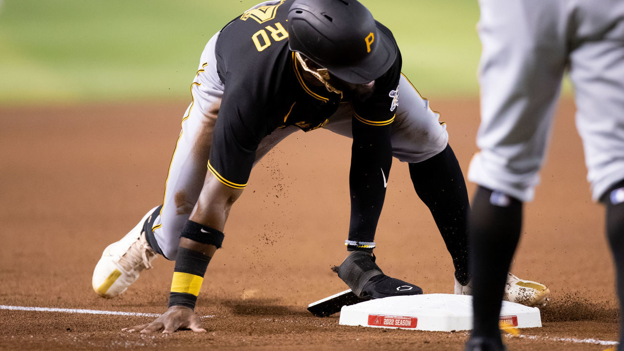 PHOENIX, AZ - AUGUST 09: Pittsburgh Pirates Infielder Rodolfo Castro (14) drops his cell phone while sliding into third base during a Baseball game between the Pittsburgh Pirates and the Arizona Diamondbacks on August 9th, 2022, at Chase Field in Phoenix, AZ.
