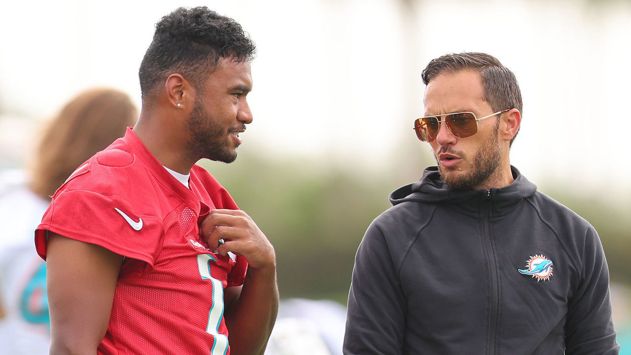 MIAMI GARDENS, FLORIDA - JULY 27: Head coach Mike McDaniel of the Miami Dolphins talks with Tua Tagovailoa #1 during training camp at Baptist Health Training Complex on July 27, 2022 in Miami Gardens, Florida.