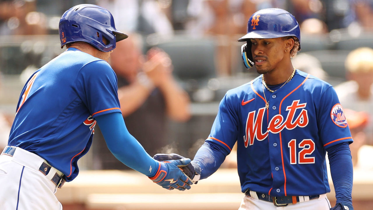 NEW YORK, NEW YORK - AUGUST 10: Francisco Lindor #12 high-fives Brandon Nimmo #9 of the New York Mets during the sixth inning against the Cincinnati Reds at Citi Field on August 10, 2022 in the Queens borough of New York City.
