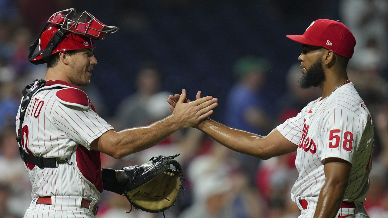 PHILADELPHIA, PA - AUGUST 10: J.T. Realmuto #10 of the Philadelphia Phillies celebrates with Seranthony Dominguez #58 after the game against the Miami Marlins at Citizens Bank Park on August 10, 2022 in Philadelphia, Pennsylvania. The Phillies defeated the Marlins 4-3.