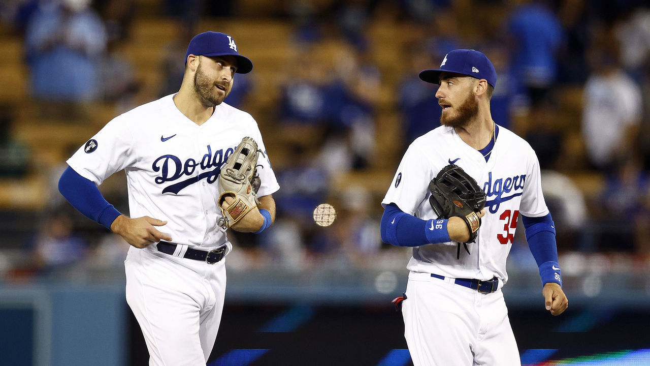 LOS ANGELES, CALIFORNIA - AUGUST 10: Joey Gallo #12 and Cody Bellinger #35 of the Los Angeles Dodgers celebrate a 8-5 win against the Minnesota Twins at Dodger Stadium on August 10, 2022 in Los Angeles, California.