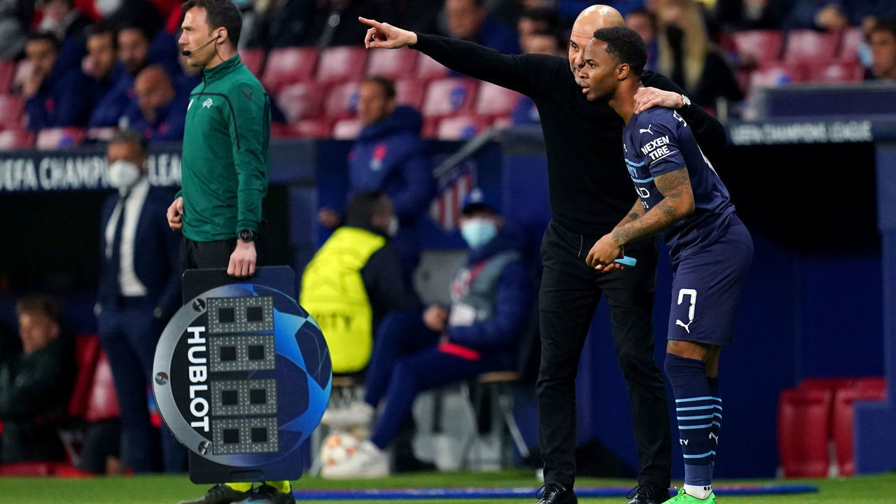 Manchester City's Raheem Sterling speaks to manager Pep Guardiola before coming on as substitute during the UEFA Champions League quarter final, second leg match at the Wanda Metropolitano Stadium, Madrid. Picture date: Wednesday April 13, 2022.