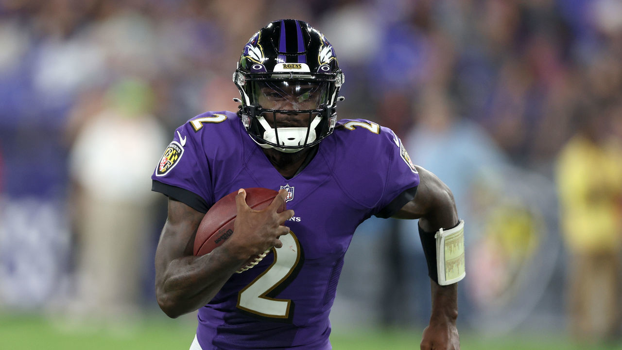 BALTIMORE, MARYLAND - AUGUST 11: Quarterback Tyler Huntley #2 of the Baltimore Ravens carries the ball against the Tennessee Titans during a preseason game at M&T Bank Stadium on August 11, 2022 in Baltimore, Maryland.
