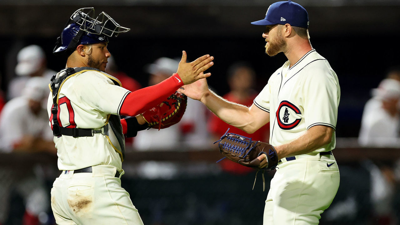 DYERSVILLE, IOWA - AUGUST 11: Willson Contreras #40 (L) and Rowan Wick #50 of the Chicago Cubs celebrate after the final out of the game against the Cincinnati Reds at Field of Dreams on August 11, 2022 in Dyersville, Iowa. The Chicago Cubs won 4-2.
