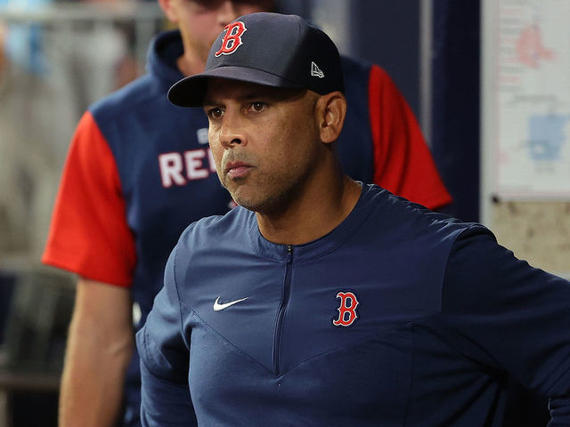 Boston Red Sox manager Alex Cora reacts with his girlfriend