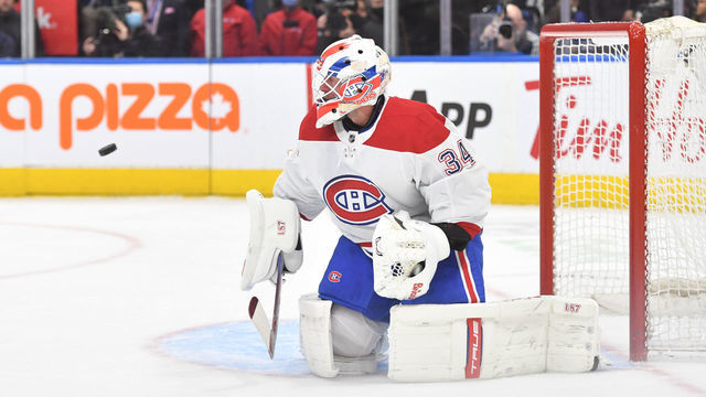 TORONTO, ON - APRIL 09: Montreal Canadiens Goalie Jake Allen (34) makes the high blocker save in the first period during the NHL regular season game between the Montreal Canadiens and the Toronto Maple Leafs on April 09, 2022, at Scotiabank Arena in Toronto, ON, Canada.
