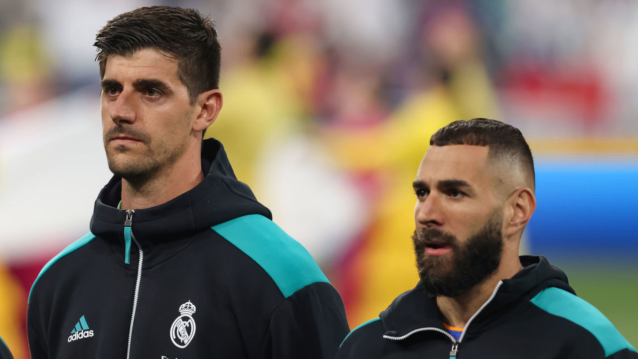 PARIS, FRANCE - MAY 28: Thibaut Courtois and Karim Benzema of Real Madrid look on during the line up prior to the UEFA Champions League final match between Liverpool FC and Real Madrid at Stade de France on May 28, 2022 in Paris, France.