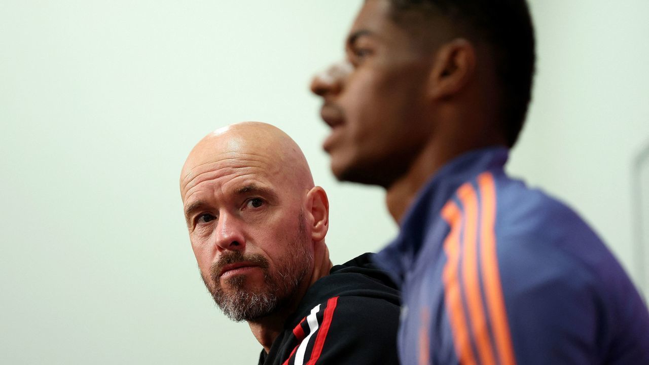 Manchester United's manager Erik ten Hag (L) and player Marcus Rashford attend a press conference in Melbourne on July 14, 2022, ahead of their exhibition football match against Melbourne Victory. - -- IMAGE RESTRICTED TO EDITORIAL USE - STRICTLY NO COMMERCIAL USE --