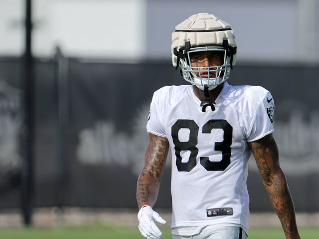 Las Vegas Raiders tight end Darren Waller (83) is tackled by